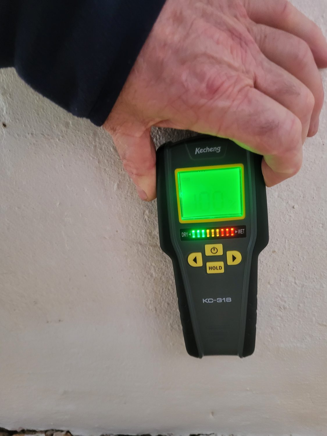 Moisture meter showing a high reading during an independent damp survey