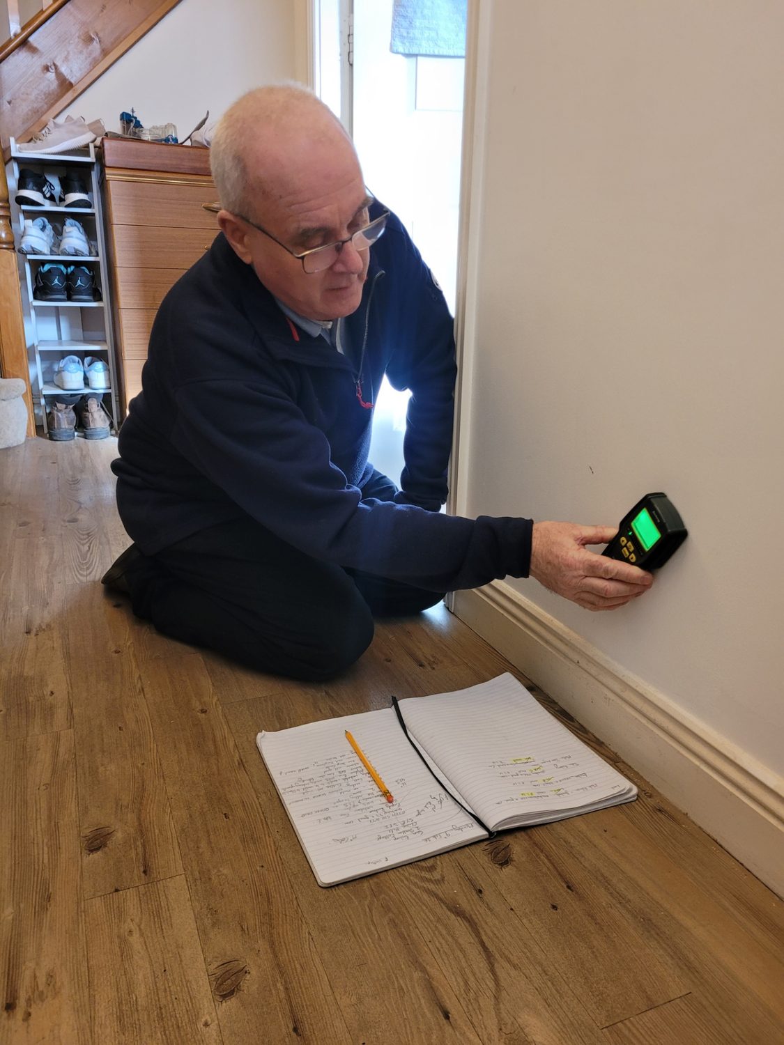 Stephen Thomas taking moisture readings during an independent damp inspection