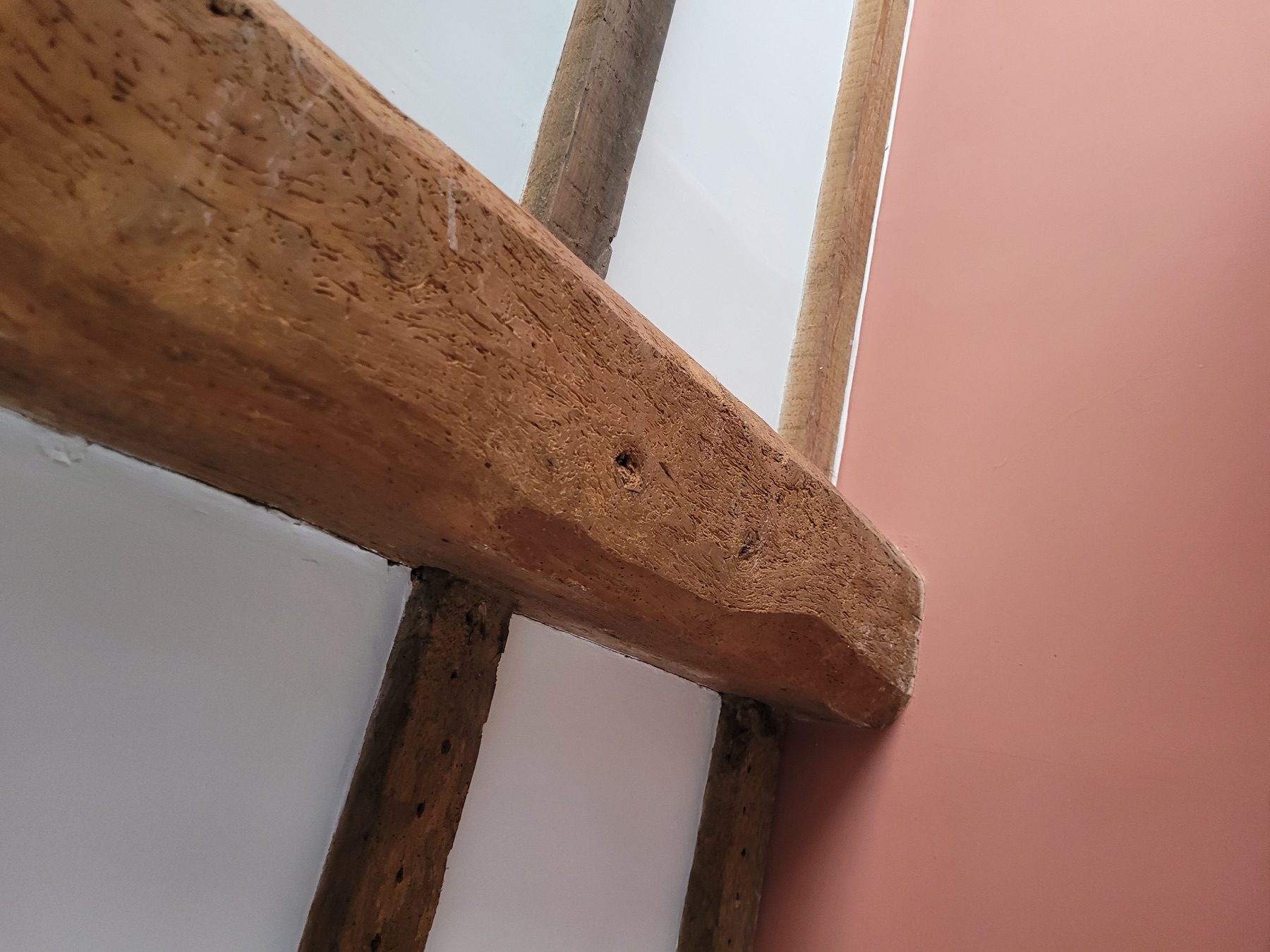 Close timber check on the underside of an exposed beam